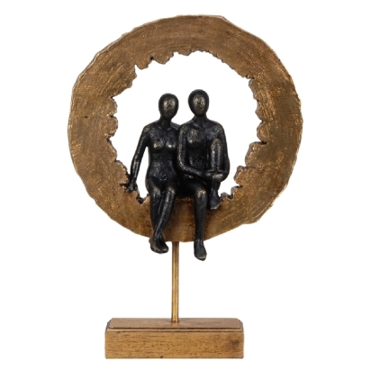 Figures in wooden slice sculpture